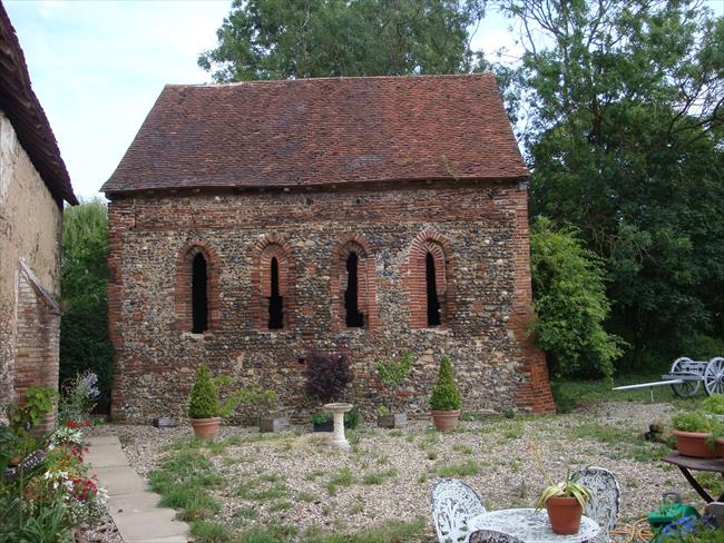 The red-brick Chapel of St Nicholas near the ruins of the abbey.
