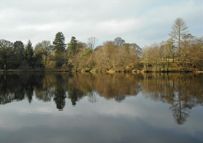 Reflections, Mugdock Loch. The keep of Mugdock Castle can be seen on the left.