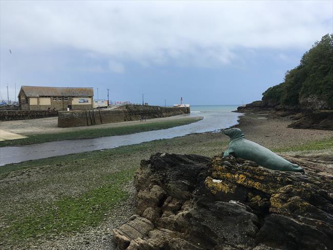 The statue of Nelson overlooking the entrance to Looe Harbour from the west bank of the river on the South West Coast Path.