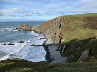 view from Dyer's Lookout. The OS route takes you to this part from where you can see two waterfalls flowing onto the beach from the clifftop, a phenomenon of this coast. However the well-walked route doesn't take you to the end of this headland.