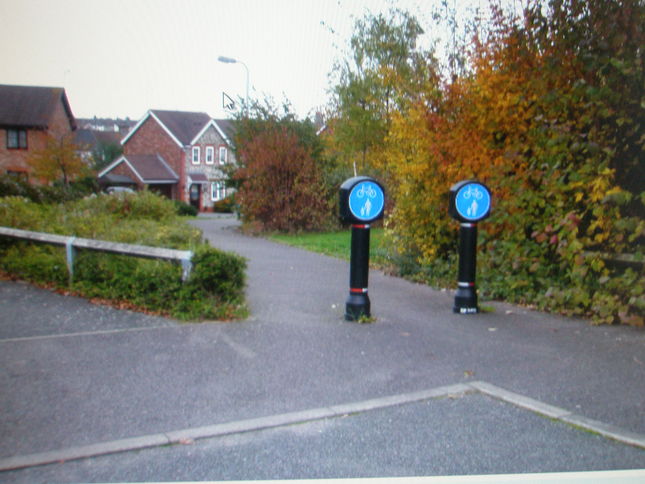 Go through these pedestrian/cycle markers at way point 6