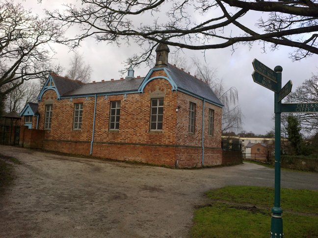The School was built in 1877 and situated in the town of Holywell. It was moved to the valley when the Holywell Inner Relief Road was constructed in the 1980s.