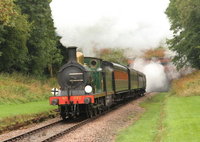 The Bluebell Railway  - a 1902 Wainwright goods engine hauls passenger carriages out of the West Hoathly tunnel